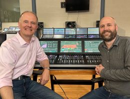 Martin Warr (Synthax) and Anthony Harrison (Calrec) in front of the Argo M 36-fader mixing console