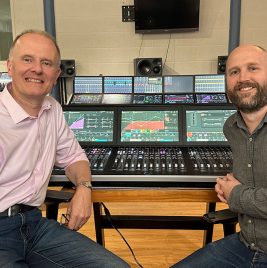 Martin Warr (Synthax) and Anthony Harrison (Calrec) in front of the Argo M 36-fader mixing console