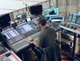 Overhead shot of Sound Engineer at a mixing console for Jonas Brothers live tour