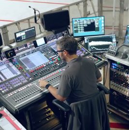 Overhead shot of Sound Engineer at a mixing console for Jonas Brothers live tour