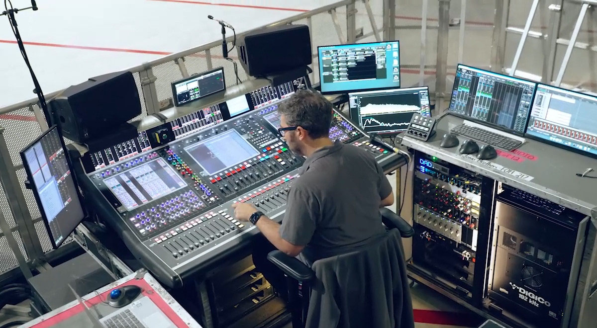 Overhead shot of Sound Engineer at a mixing console for Jonas Brothers live tour